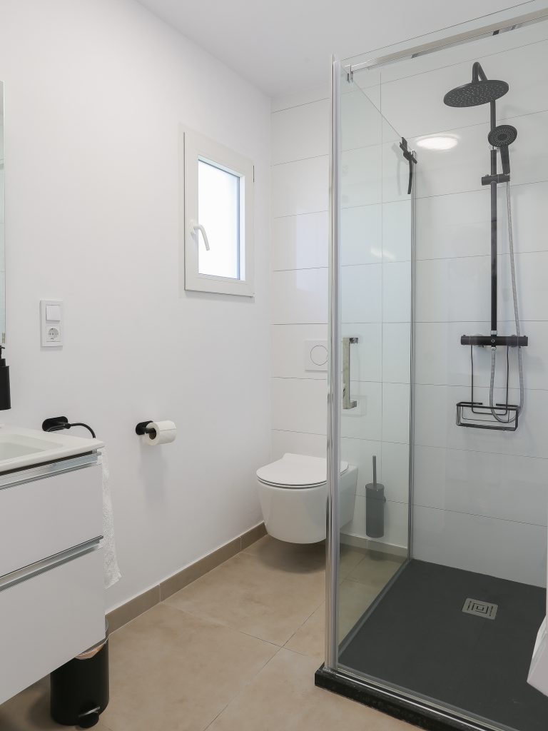 Bathroom with walk-in shower at apartment Retiro Sol B14 in Dénia