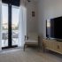 Living room with TV in Casa Valys
